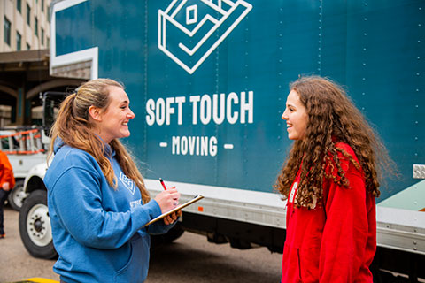 Soft Touch Moving professional working with a customer